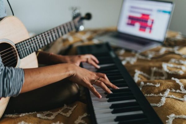 person playing black and white piano